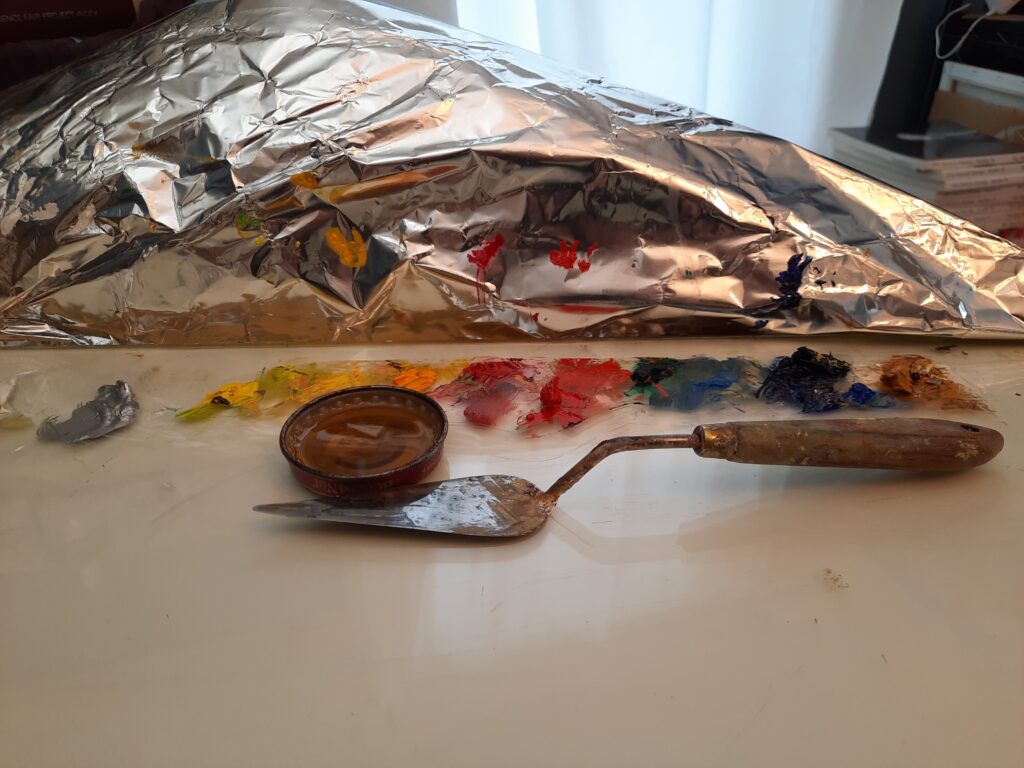 oil paint on palette with palette knife for size